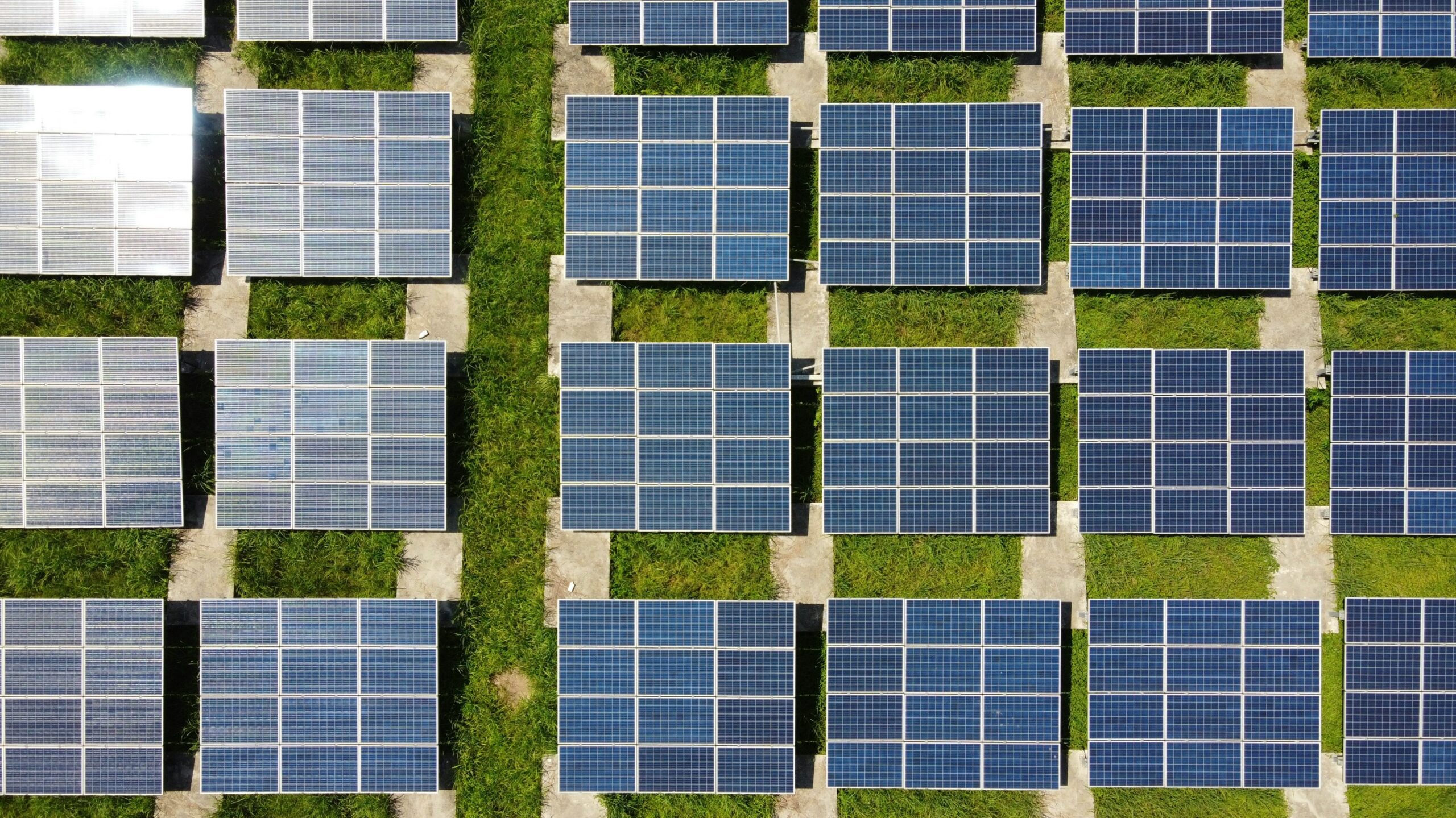 Solar panels in a green field