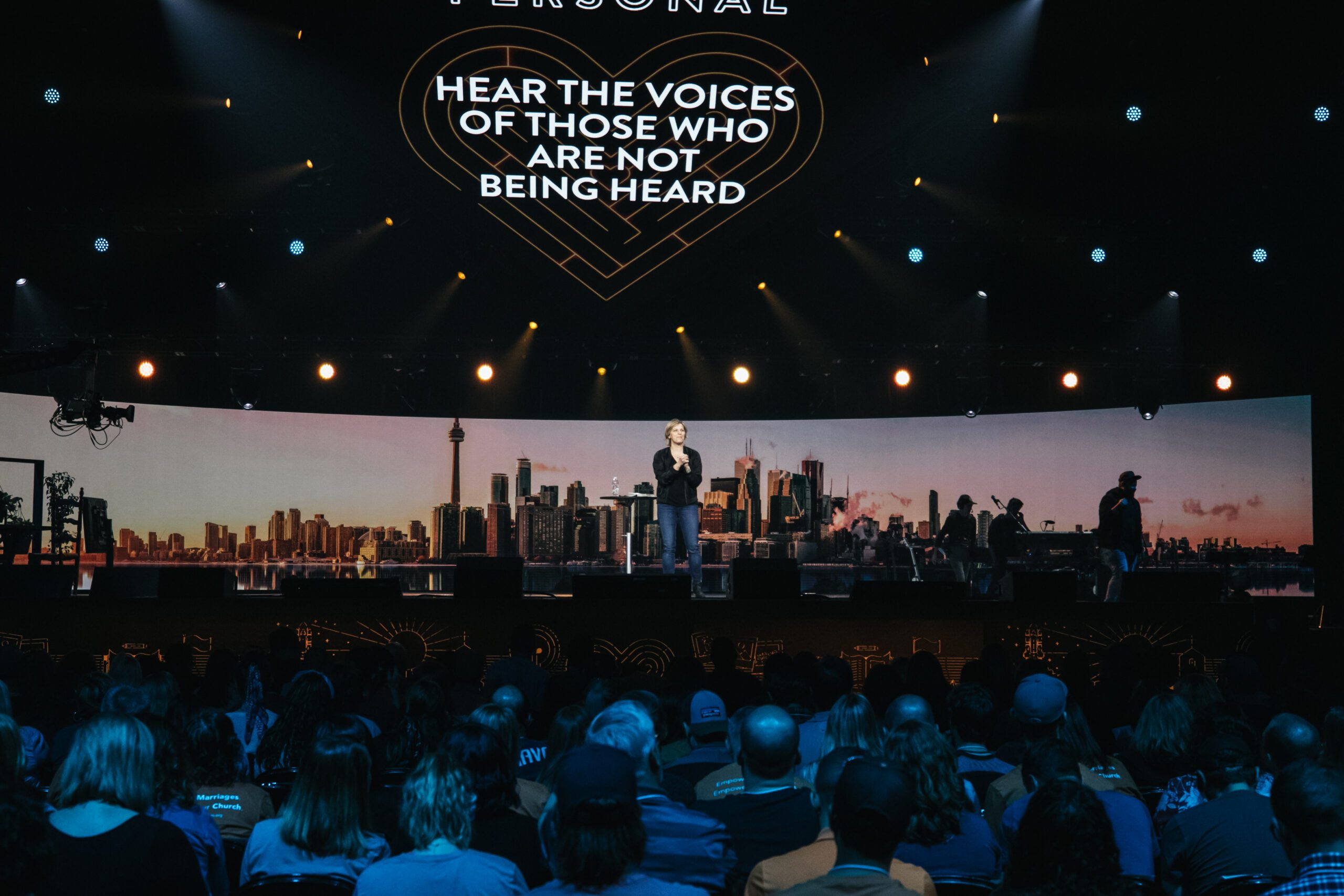 Speaker on a stage with an audience