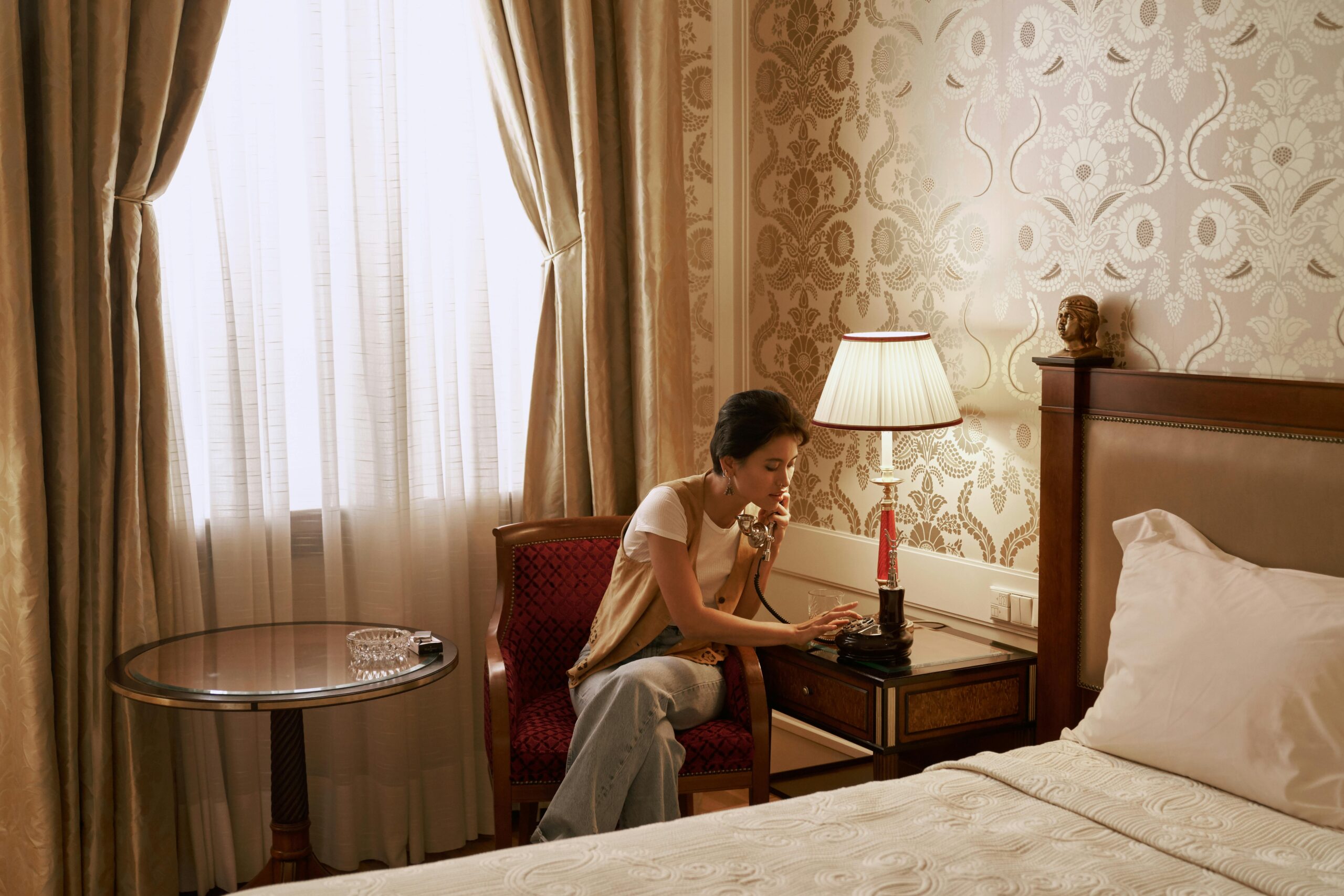 Person on phone in luxury hotel room