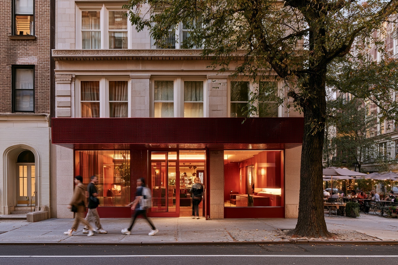Design-led hospitality property at street level with people moving past the entrance